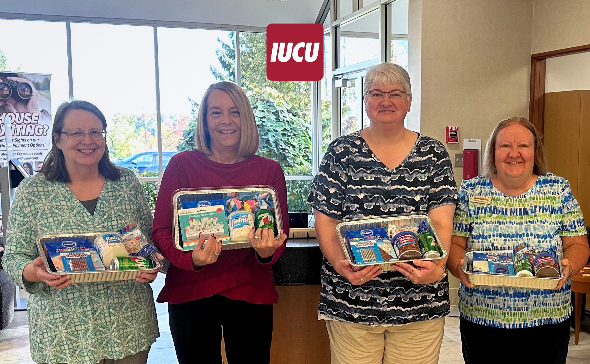 Photo of IUCU employees with birthday cake kits