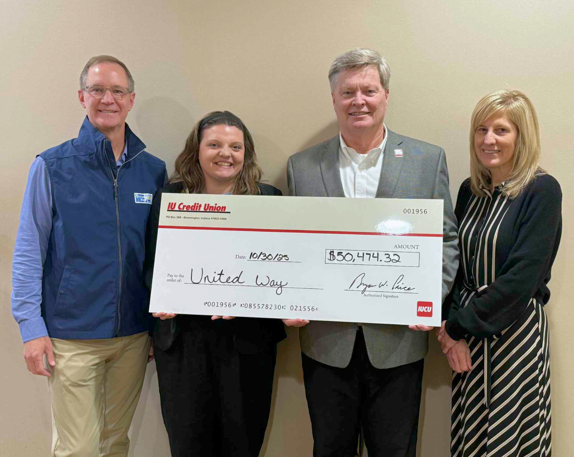 Photo of IUCU employees presenting a check to United Way