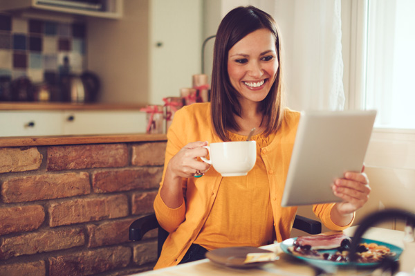 Photo of a woman reading tablet