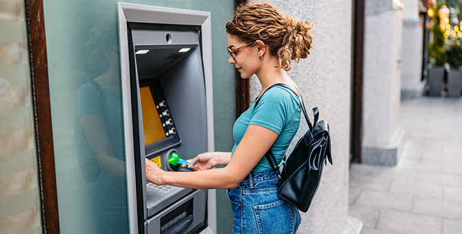 Photo of a woman using an ATM