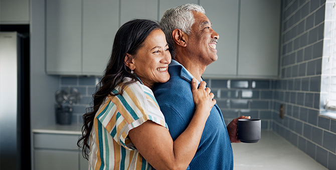 Photo of a retired couple in the kitchen.