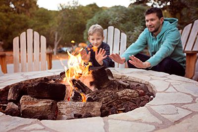 Man with Son at a Fire Pit