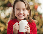 Photo of child drinking hot chocolate